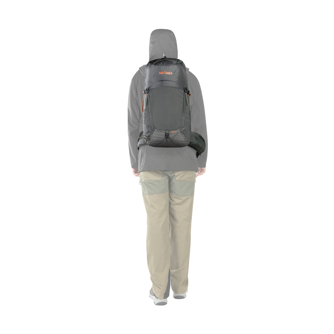 Back view of person wearing the 27 litre Tatonka Norix pack with detachable padded hip belt in place - Titan Grey