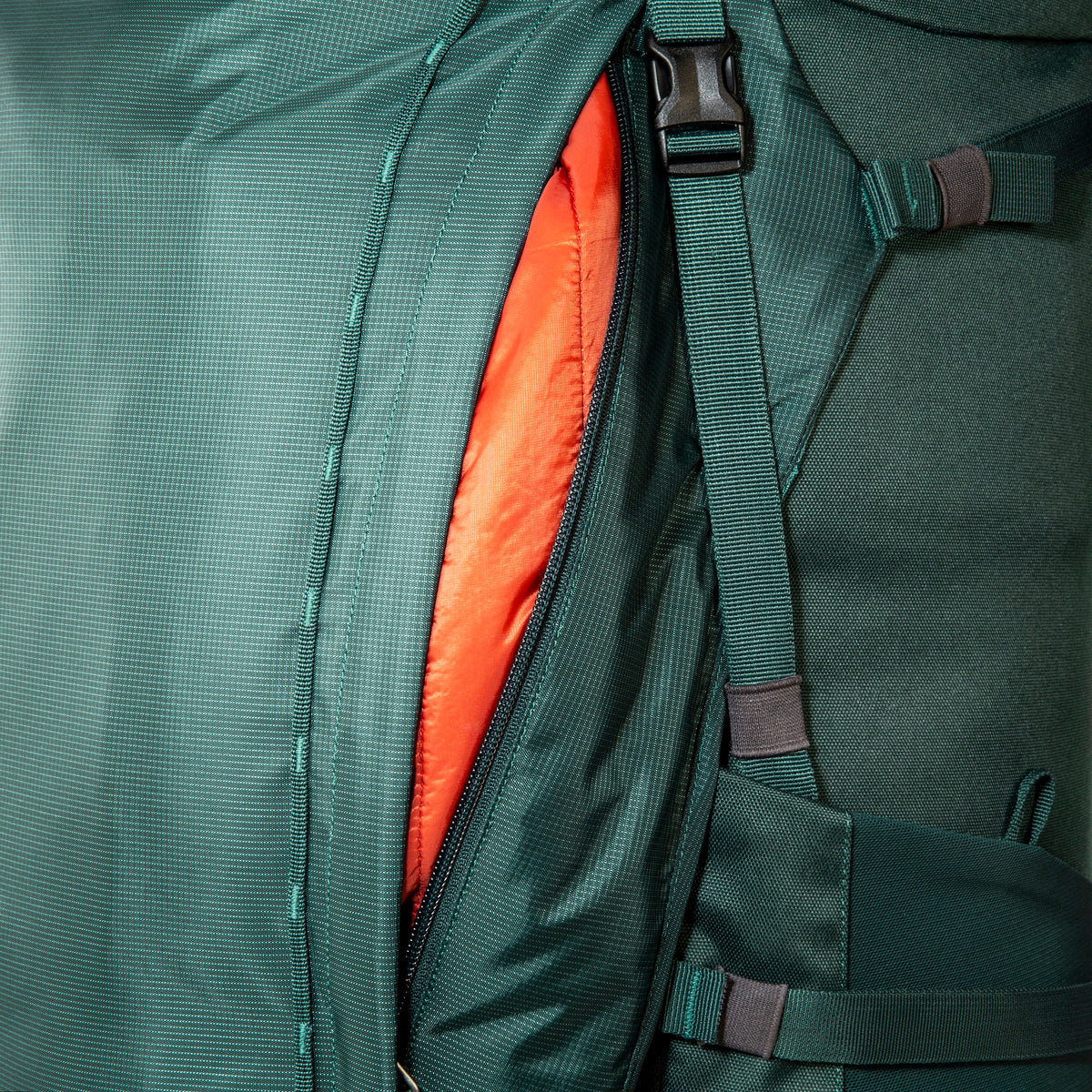 Close up of zippered side pocket on 70/10 litre Tatonka branded Yukon pack – Jasper