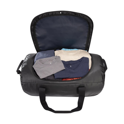 Open view packed with clothes of the Tatonka Basic Barrel 85 L in matte black | TADI.6982.408