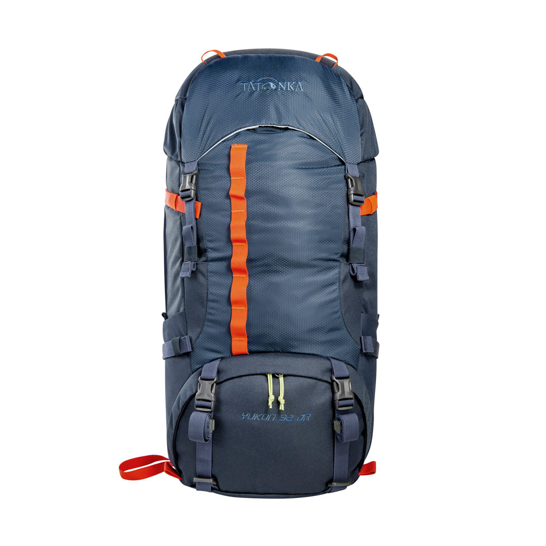 Front view of 32 litre Tatonka branded Yukon 32 JR pack with load control straps, side compression straps, compression around perimeter of base, zipped side pockets with expansion pleats and standard side pockets. Also features Gear loops on lid, front daisy chain, and hiking pole fixation points – Navy with Orange highlights