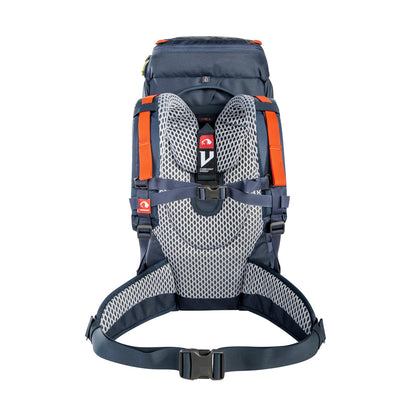 Back view of 32 litre Tatonka branded Yukon 32 JR pack with V Comfort Vario carrying system including length-adjustable for body sizes from age 8 through to smaller adults, padded hip belt for proper weight transfer, carrying handle, single-handed hip belt adjustment through redirected fixation design and height-adjustable chest strap – Navy with Orange highlights