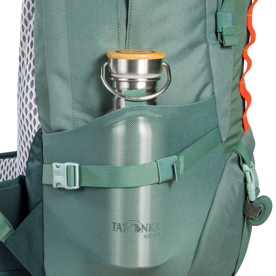 Close up of water bottle (not included) in side pocket of 32 litre Tatonka branded Yukon 32 JR pack – Sage Green