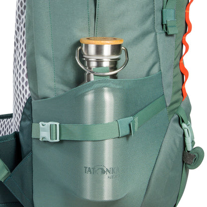 Close up of water bottle (not included) in side pocket of 32 litre Tatonka branded Yukon 32 JR pack – Sage Green