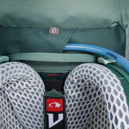 Close up exterior view of hydration system showing drinking tube coming out of slot between the shoulder straps - Sage Green