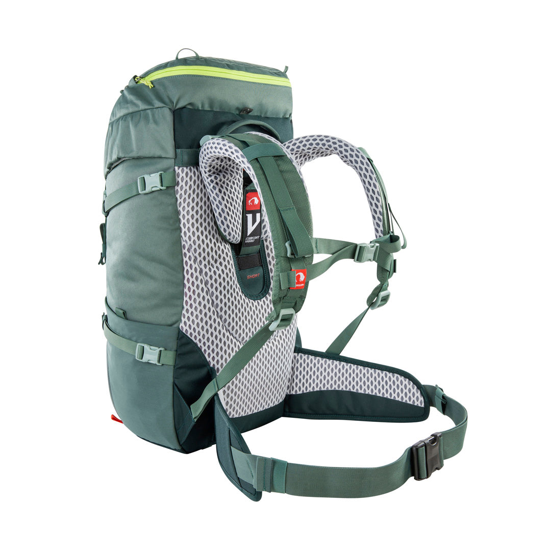 Back three-quarter view of 32 litre Tatonka branded Yukon 32 JR pack with V Comfort Vario carrying system including length-adjustable for body sizes from age 8 through to smaller adults, padded hip belt for proper weight transfer, carrying handle, single-handed hip belt adjustment through redirected fixation design and height-adjustable chest strap – Sage Green