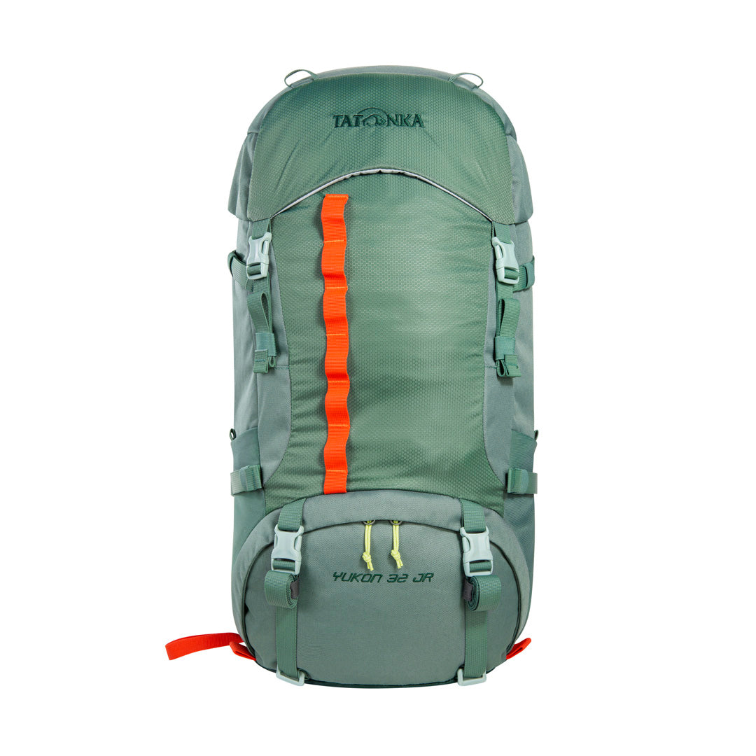 Front view of 32 litre Tatonka branded Yukon 32 JR pack with load control straps, side compression straps, compression around perimeter of base, zipped side pockets with expansion pleats and standard side pockets. Also features Gear loops on lid, front daisy chain, and hiking pole fixation points – Sage Green with Orange highlights