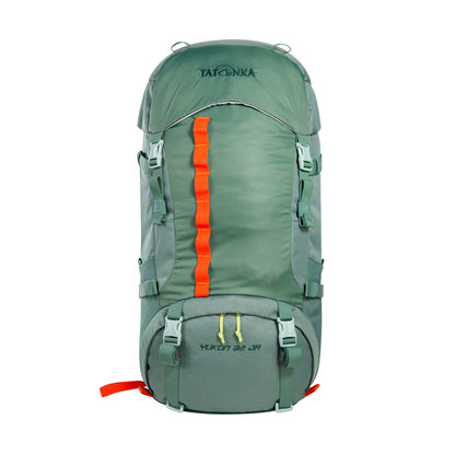 Front view of 32 litre Tatonka branded Yukon 32 JR pack with load control straps, side compression straps, compression around perimeter of base, zipped side pockets with expansion pleats and standard side pockets. Also features Gear loops on lid, front daisy chain, and hiking pole fixation points – Sage Green with Orange highlights